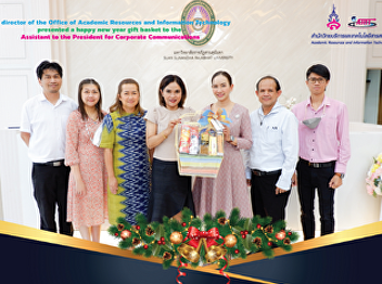 The director of the Office of Academic
Resources and Information Technology
presented a happy new year gift basket
to the Assistant to the President for
Corporate Communications.